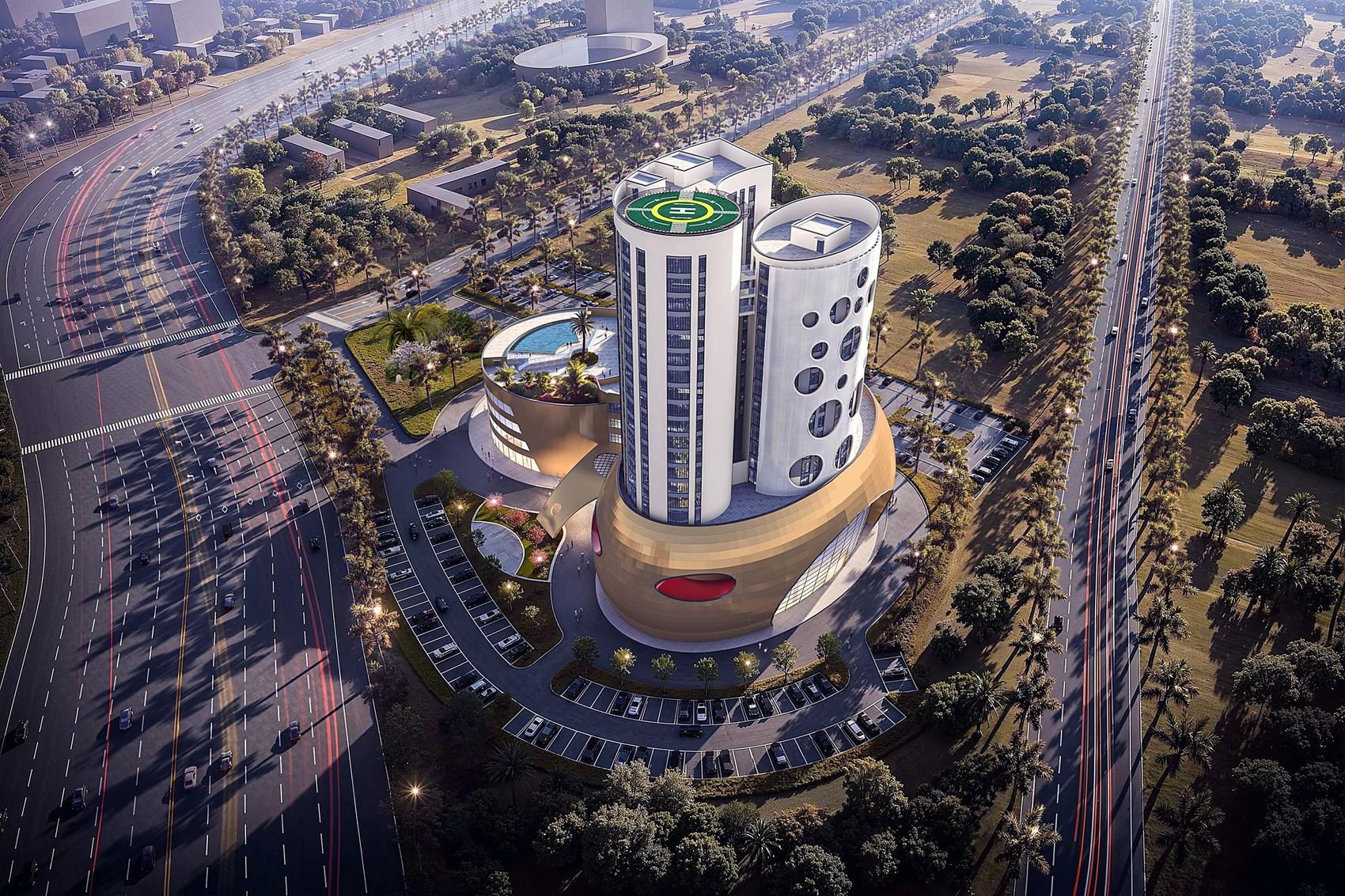 Aerial view of Tri-Tower and its podium at dusk, set among landscaped grounds